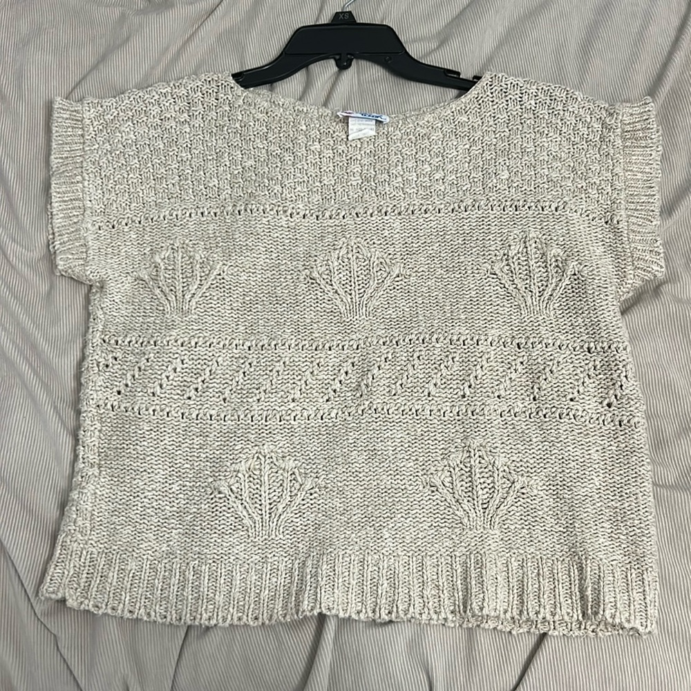 Short sleeve crocheted cropped sweater.